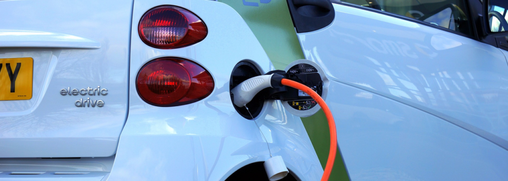 Electric vehicle being charged Faraday Battery Challenge Innovation Feasibility