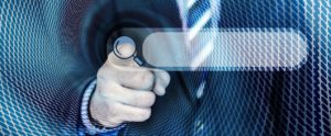 Man in suit pressing search button on screen Innovation grants